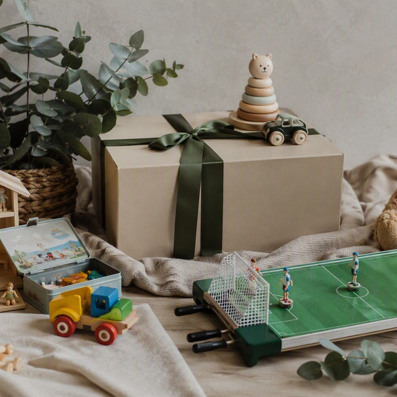 Gift box with toys and a table football game