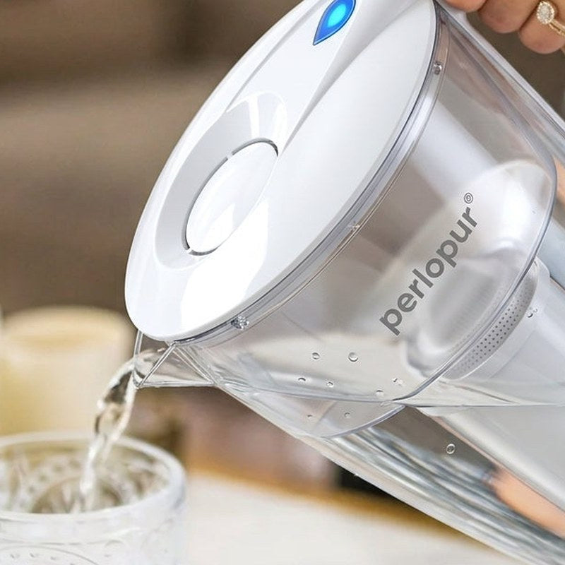 Water Filtration: PearlCo jug pouring into a glass