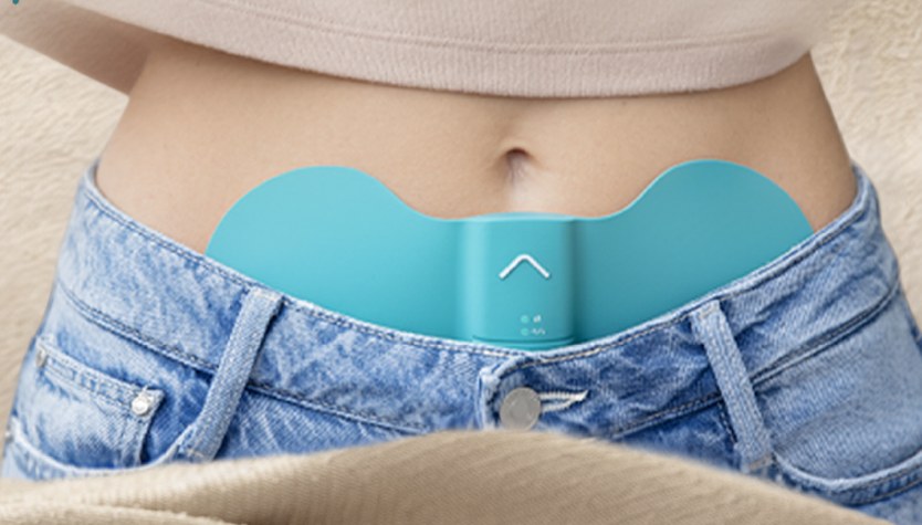 The Beurer EM 55 worn at the waist under a knit top