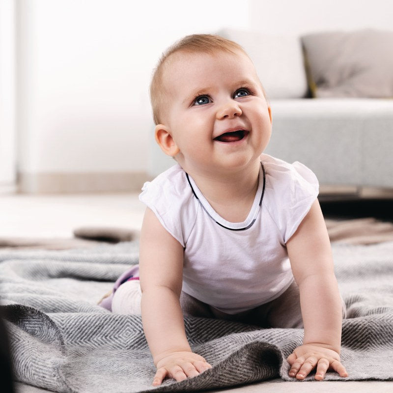 Baby crawling on a blanket